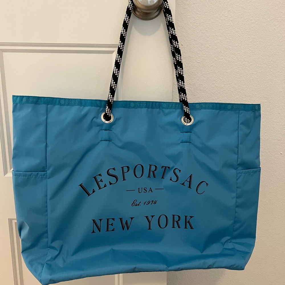 Lesportsac Large 2 Way Tote Vivid Blue and Black
Reversible tote!